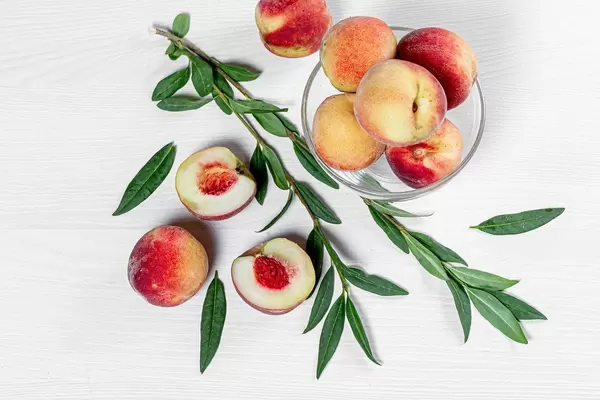Fresh ripe peaches with leaves. Top view (Flip 2019)