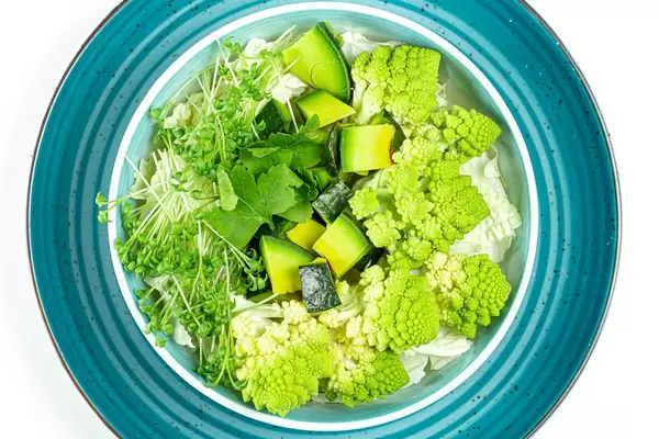 Fresh salad with avocado, romanesco cabbage and watercress. Top view (Flip 2020)