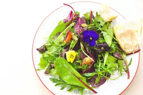 Fresh salad with edible flowers