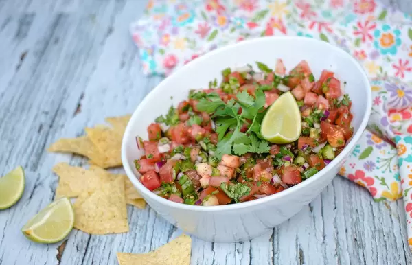Fresh Salsa in a White Bowl with nachos on the side