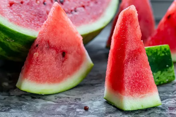 Fresh sliced watermelon half and pieces on the table (Flip 2019) (Flip 2019)
