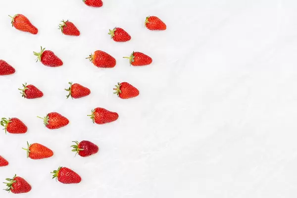 Fresh strawberries on the grey marble with copy space