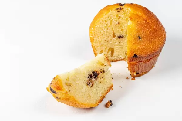 Fresh sweet sponge muffin on white background (Flip 2019)