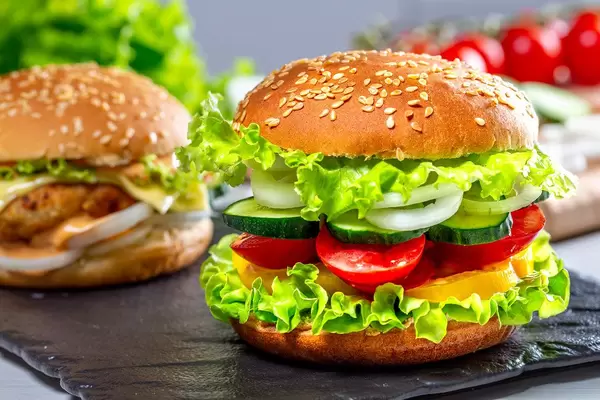 Fresh tasty burger on black stone tray (Flip 2019)