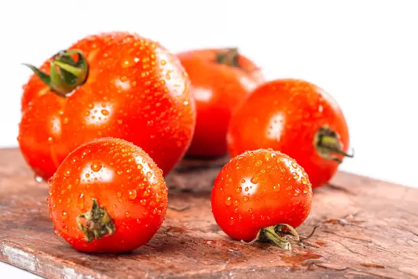 Fresh tomatoes with water drops