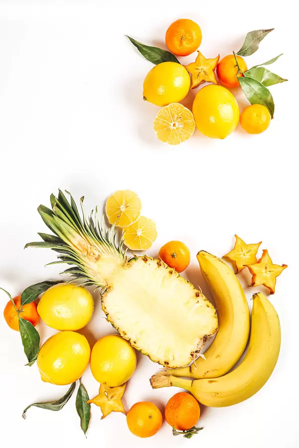 Fresh tropical fruits on white background