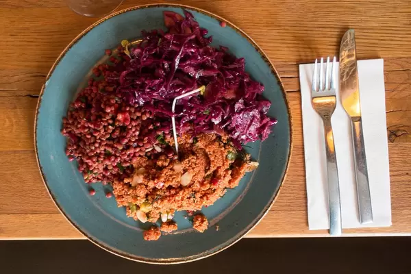 Fresh vegan salad with red cabbage, couscous and lentils