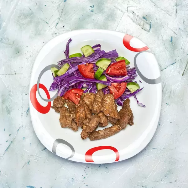 Fresh vegetable salad with soy sauce and chicken fillet