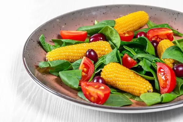 Fresh vegetable salad with spinach and dogwood close up (Flip 2019)