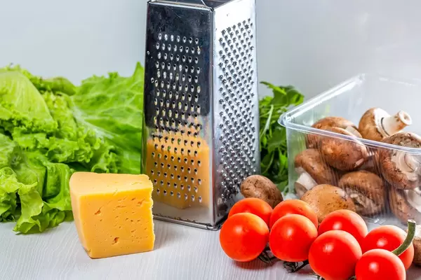 Fresh vegetables and mushrooms with cheese and grater (Flip 2019)