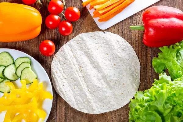 Fresh vegetables and round pita for cooking summer snacks (Flip 2019)