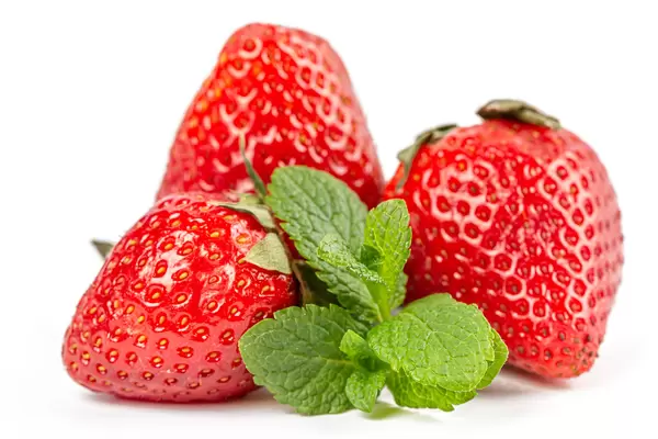 Fresh whole strawberry and green mint