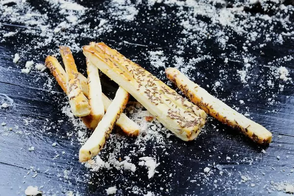 Freshly baked cheese crackers with caraway seeds