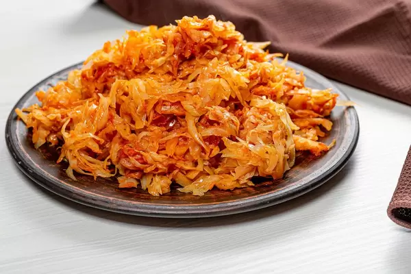 Fried cabbage in a brown plate on the table (Flip 2019)