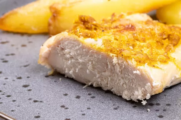 Fried Chicken Breasts with Cheese sliced on the plate