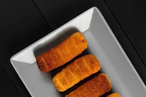 Fried Chicken Sticks on the square plate