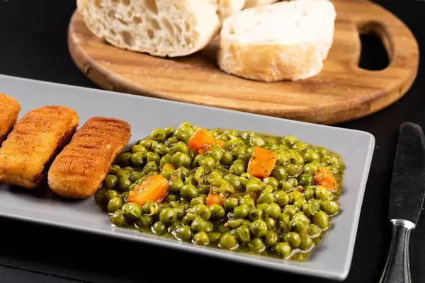 Fried Chicken Sticks with cooked Peas
