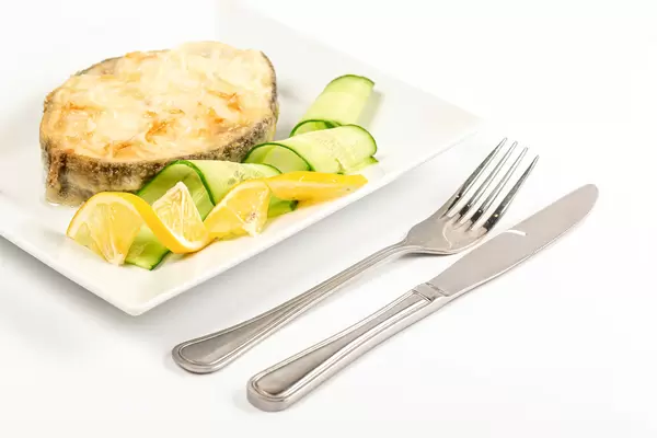 Fried escolar fish with lemon and cucumber
