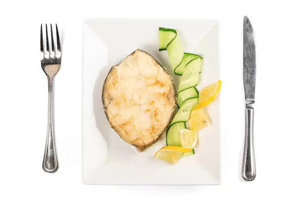 Fried oily fish steak, top view