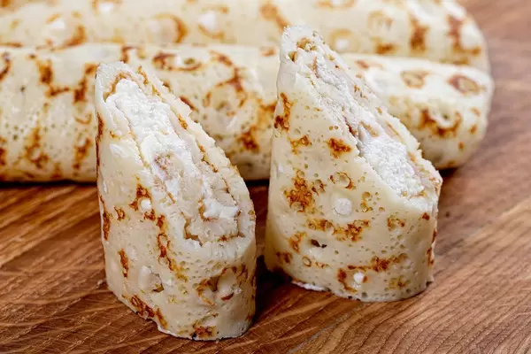Fried pancakes rolls stuffed with sweet cottage cheese (Flip 2019)