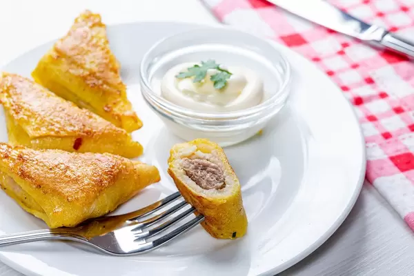 Fried pancakes with meat, triangular shape (Flip 2019)