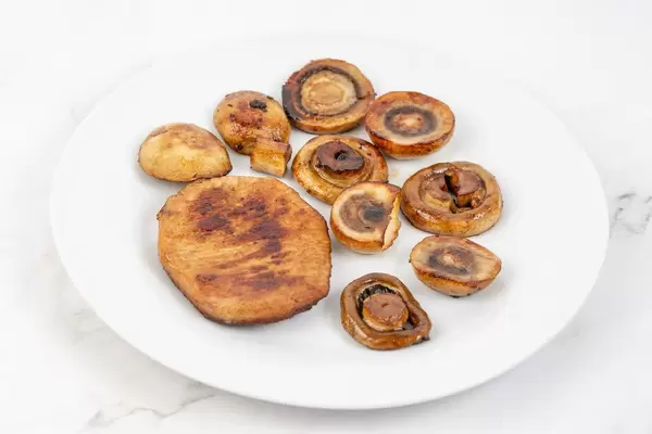 Fried Pork Chops and Mushrooms on the plate