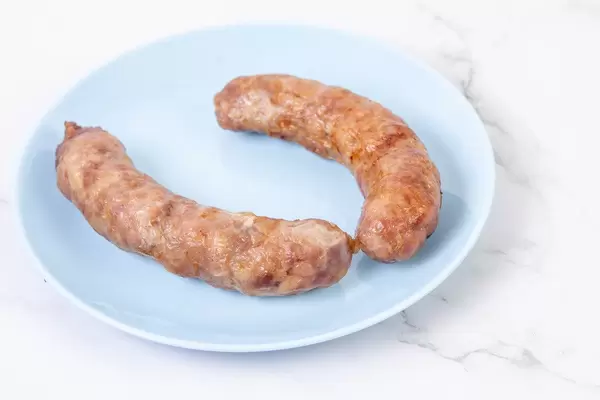 Fried Pork Sausages served on the blue plate (Flip 2019)