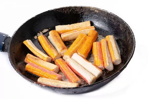 Fried Surimi Sticks in the frying pan (Flip 2019)