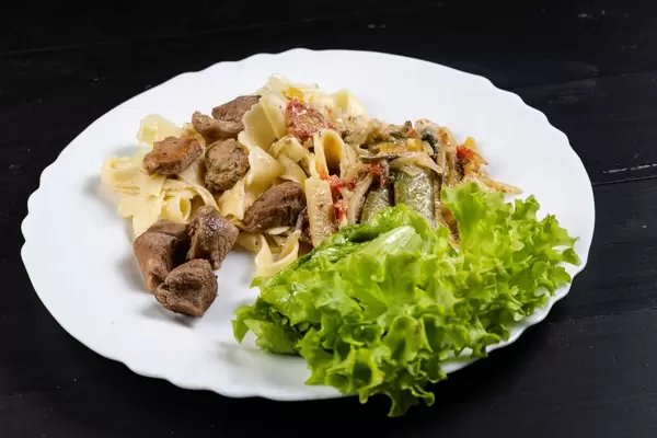 Fried Vegetables with Pork Meat and Lettuce in the plate (Flip 2019)