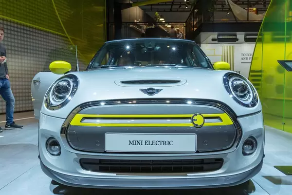 Front view of the electric car Mini Cooper SE with electric motor, shown at a German automobile exhibition