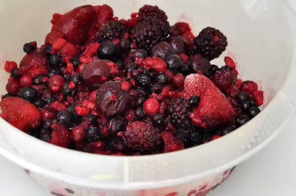 Frozen red berries for baking a cake