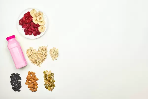 Fruit milkshake with oatmeal, raisins, apricot and pumpkin seeds