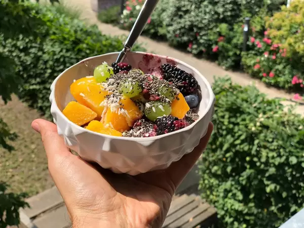 Fruit salad with mango, grapes, blackberries, blueberries and chia seeds