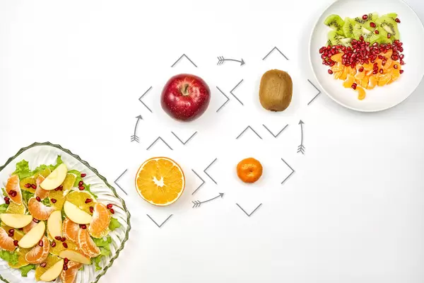 Fruit salads with orange, kiwi, apple and mandarin