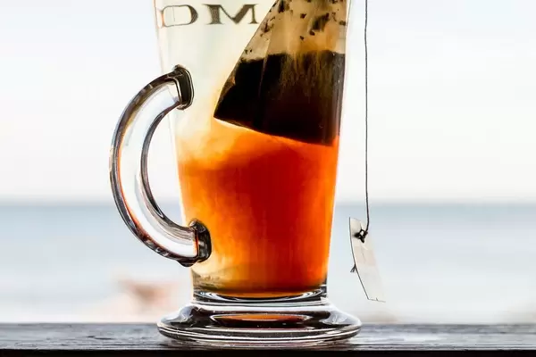 Fruit tea in a glass , close up