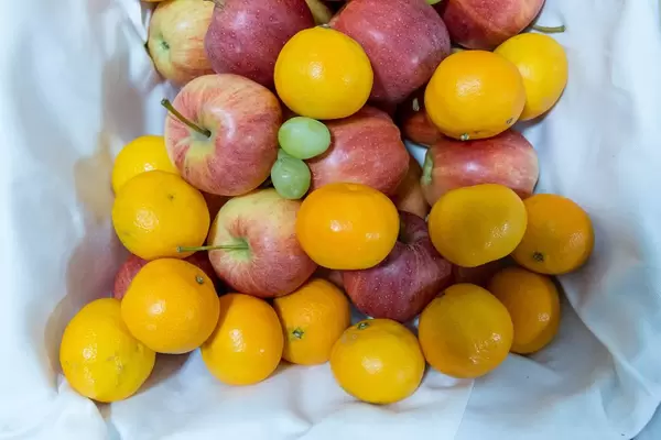 Fruits - apples, tangerines and grapes