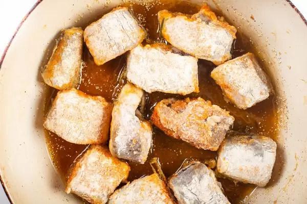Frying Hake fish in the hot oil