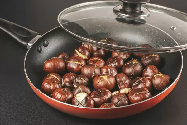 Frying pan with fried chestnuts
