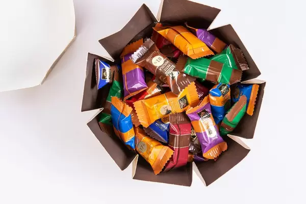 Full box of J.D. Gross Chocolate candys above white background