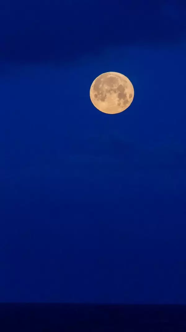 Full moon and dark blue sky