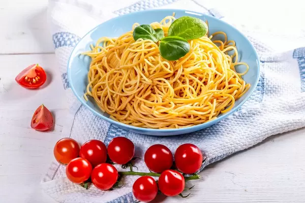 Full plate of delicious spaghetti with tomatoes (Flip 2019)