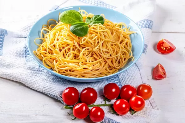 Full plate of delicious spaghetti with tomatoes