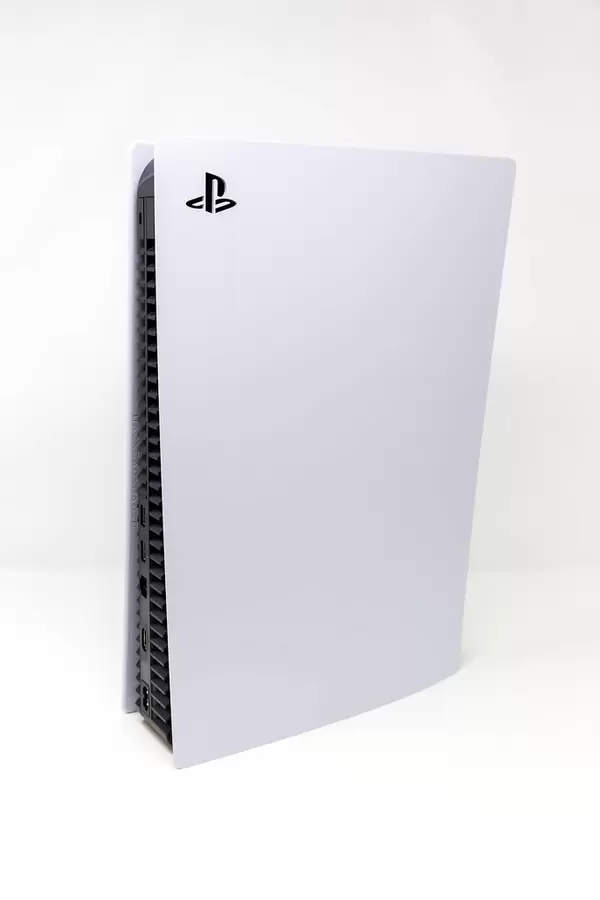 Full View of Side and Back of a Standing Sony PlayStation 5 on White Background