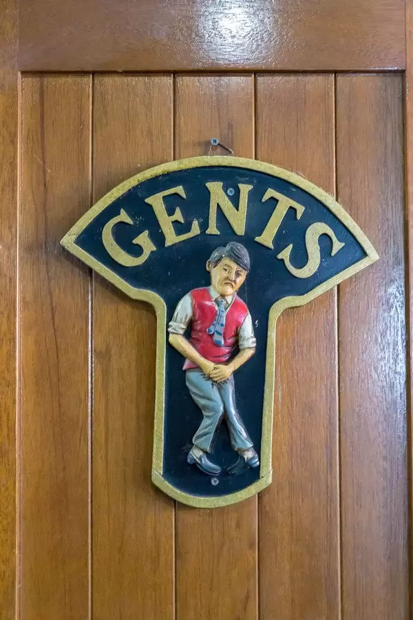 Funny men's restroom sign on a touring ship