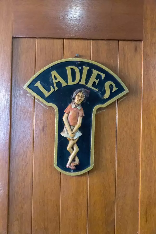 Funny women's restroom sign on a touring ship