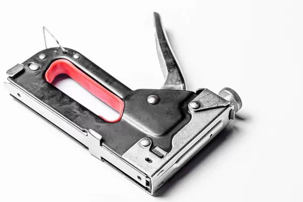 Furniture stapler on white background (Flip 2020)