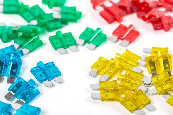 Fuses of different colors on a white background