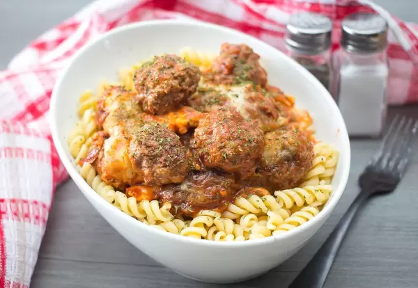 Fusilli noodles with meatballs and tomato sauce
