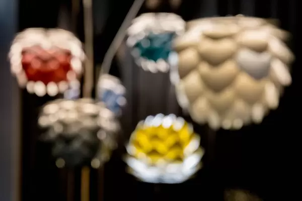 Futuristic aluminum lamps provide warm, insulated light - bokeh effect