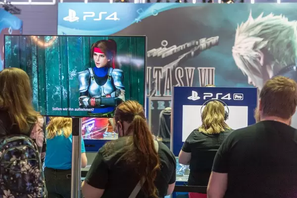 Gamers playing Final Fantasy VII Remake on PlayStation 4 at games fair Gamescom in Germany